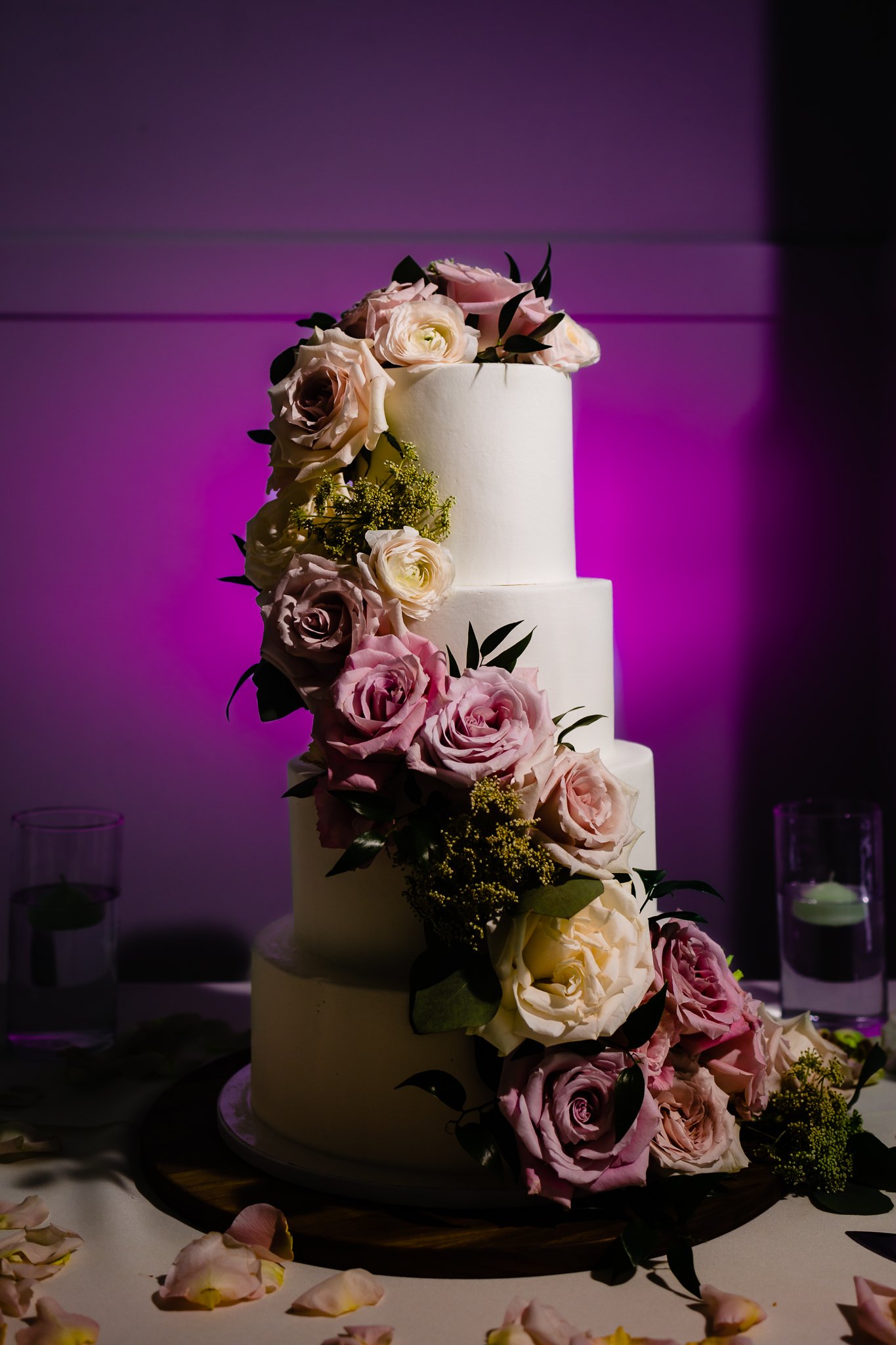 4 tier wedding cake adorned in florals