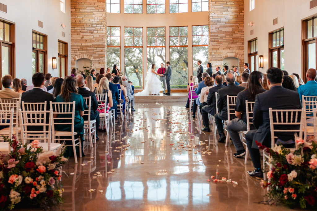 window light streams in during the chapel ceremony at canyonwood ridge in dripping springs texas